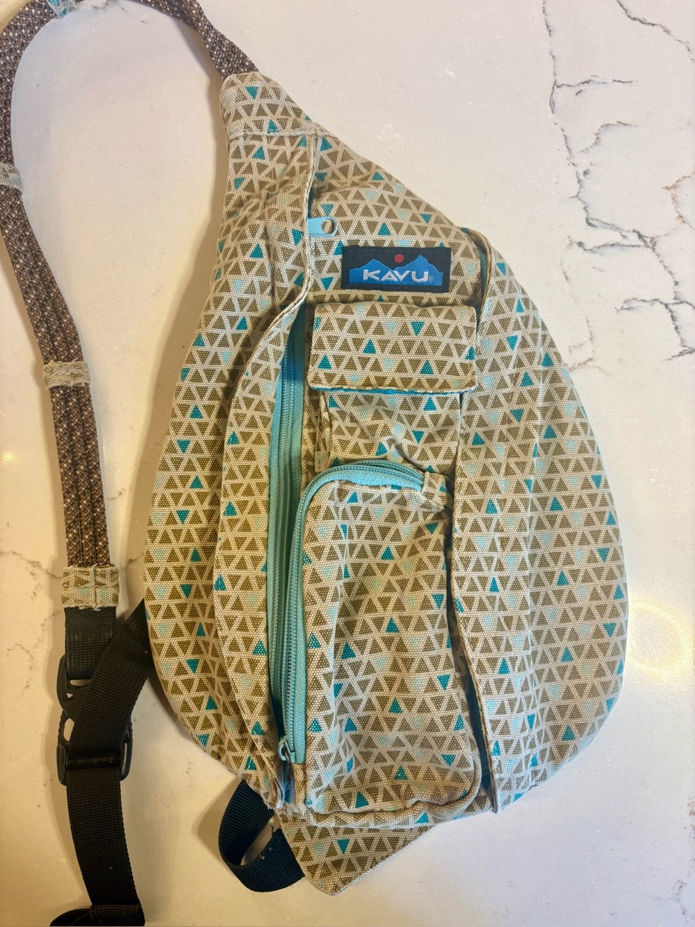 Kavu Rope Sling Backpack Bag Beige and Teal Geometric Pattern